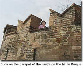 Judy on the parapet of the castle on the hill in Prague